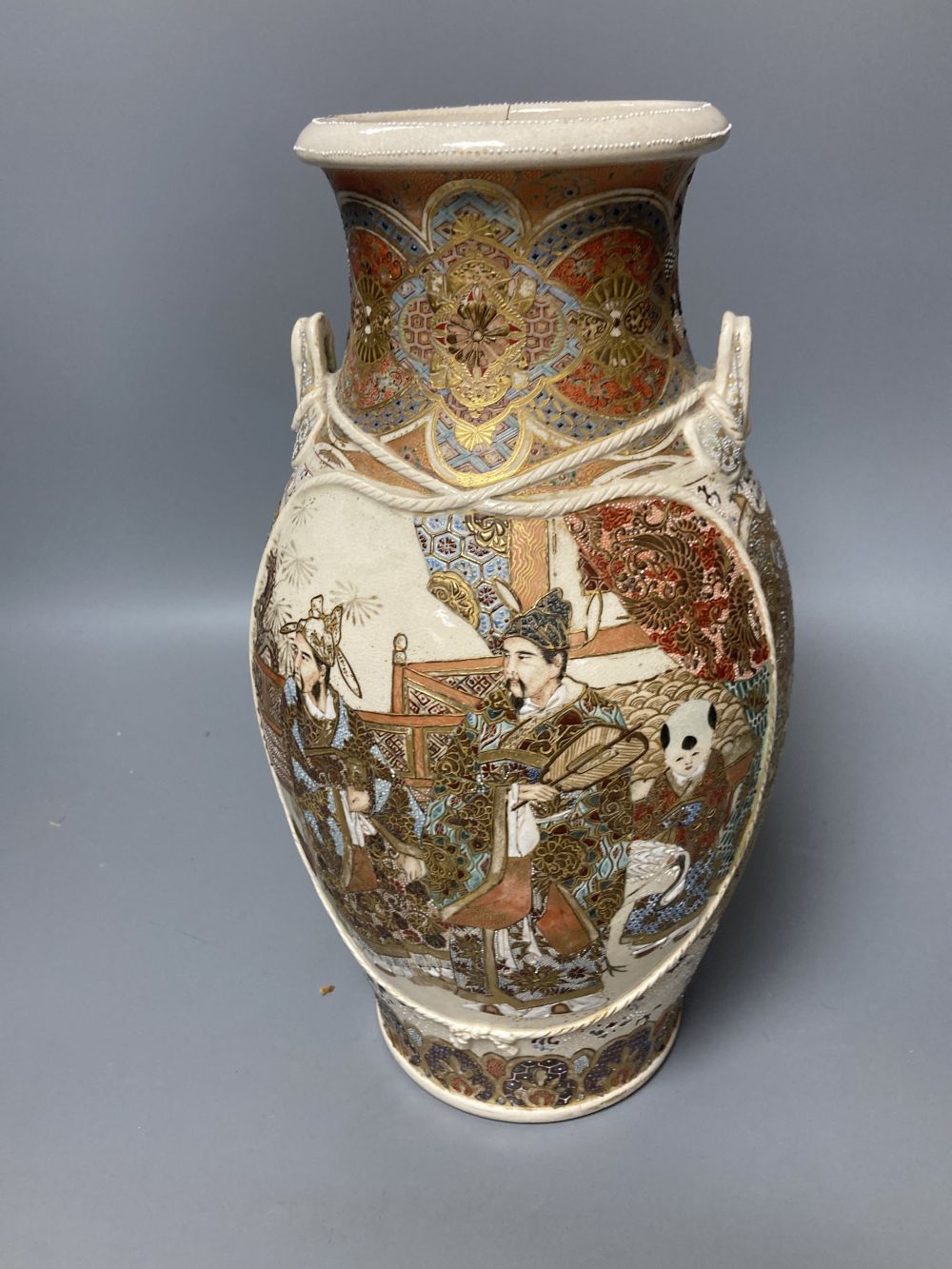 A Japanese satsuma vase, a tea cup and saucer and another vase, tallest 37cm